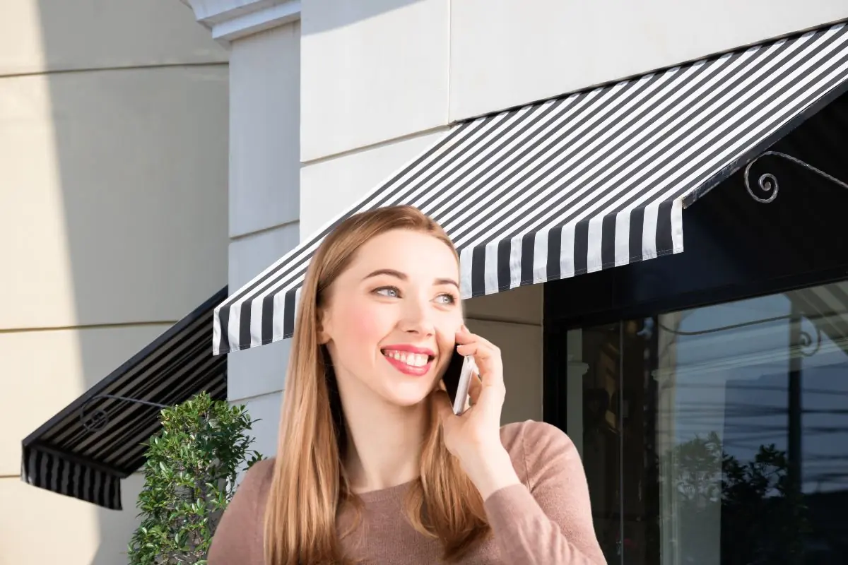 woman calling on phone with canopy view