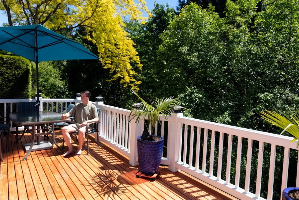 man seating in a deck patio