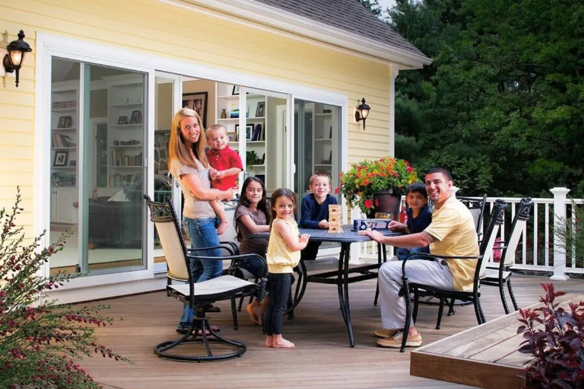 backyard deck with big happy family