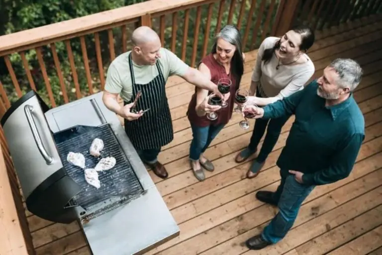 group of people on backyard deck drinking wine