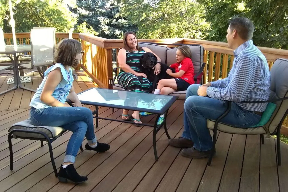 happy family staying together on outdoor living space